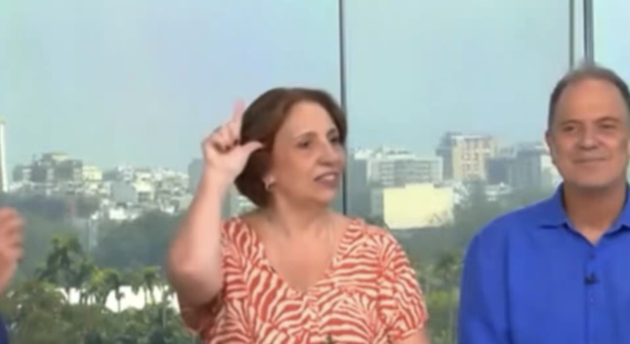 Alice Borges faz ‘L’ discretamente durante entrevista ao RJ1